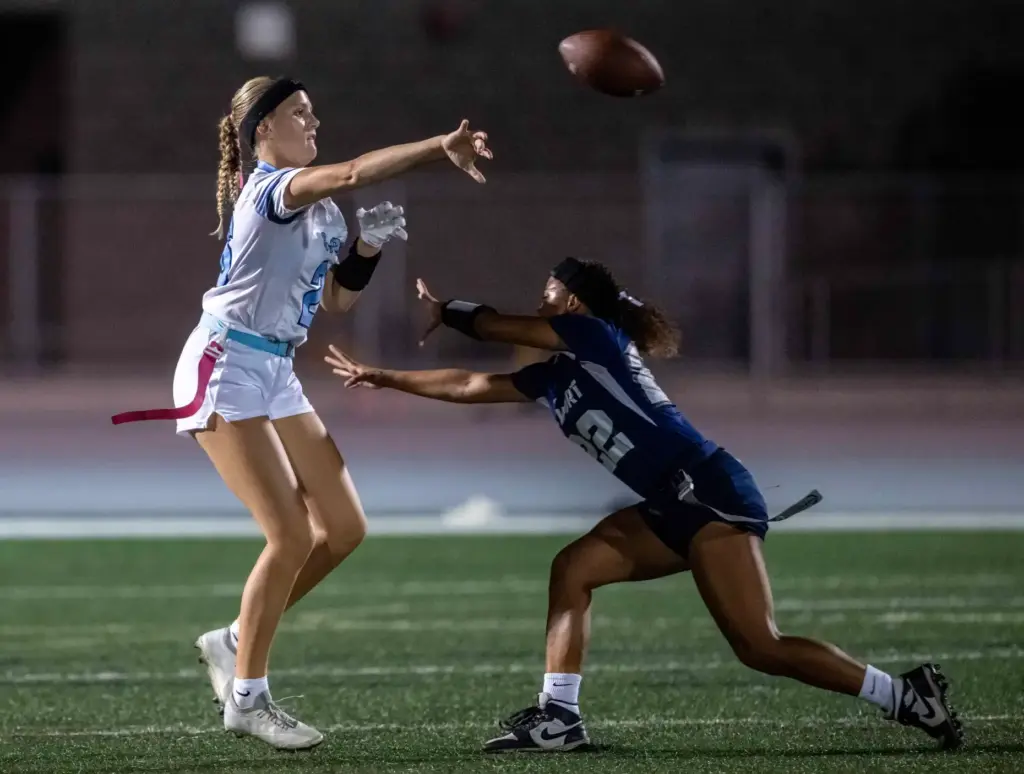Corona del Mar quarterback Charlotte Ring (26) throws the ball...