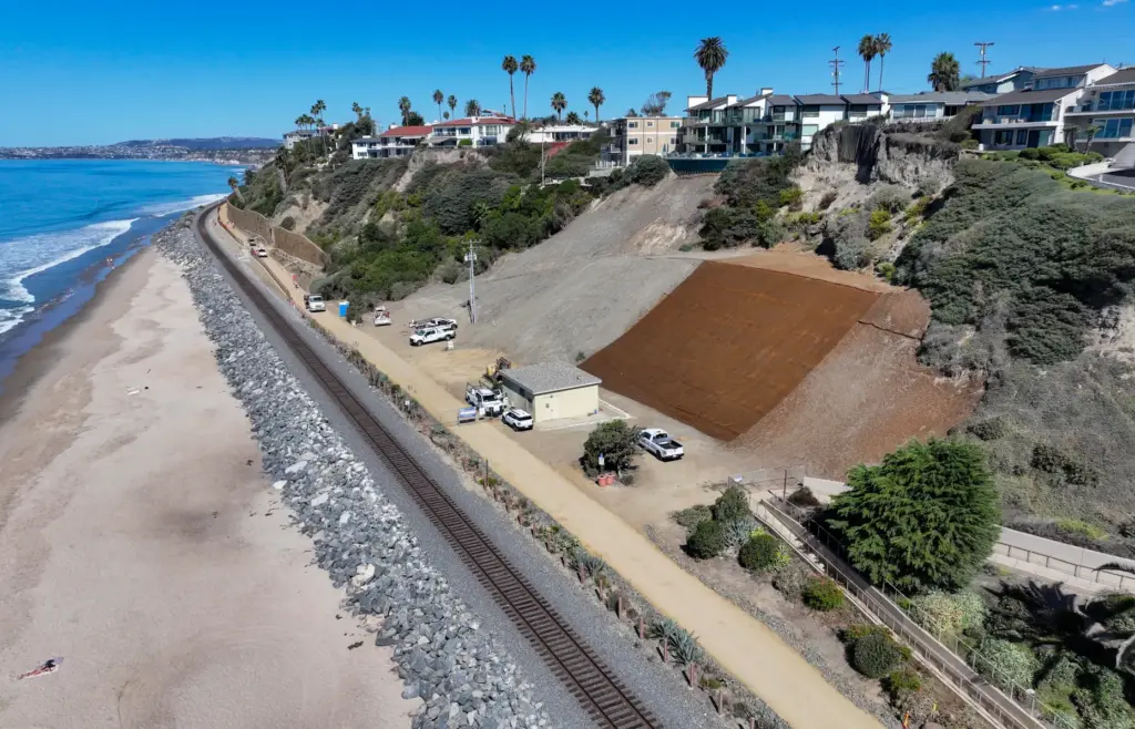 Workers put the finishing touches on the beach trail north...