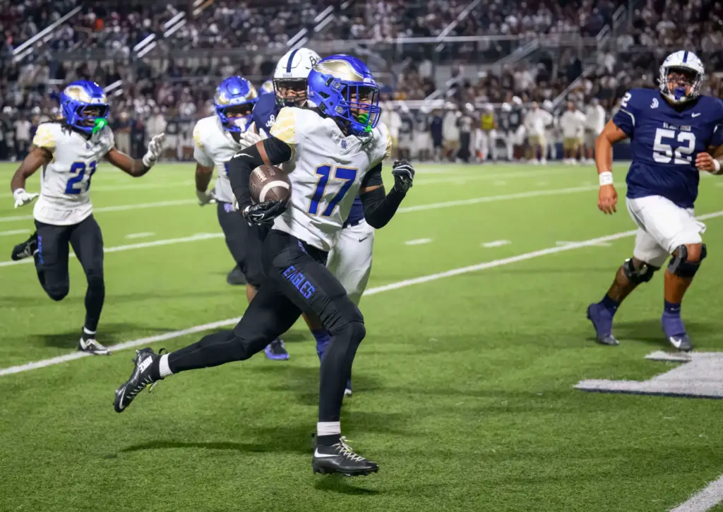 Santa Margarita defensive back Rayshawn Brandon runs an interception to...