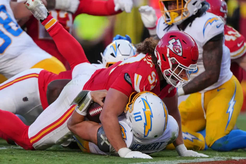 Kansas City Chiefs defensive end Ashton Gillotte (97) lands on...