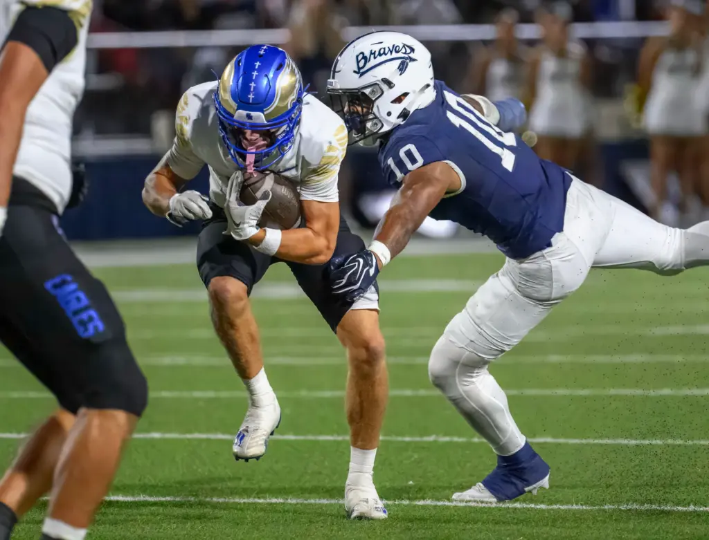 Santa Margarita wide receiver Grant van Raaphorst, left, makes a...