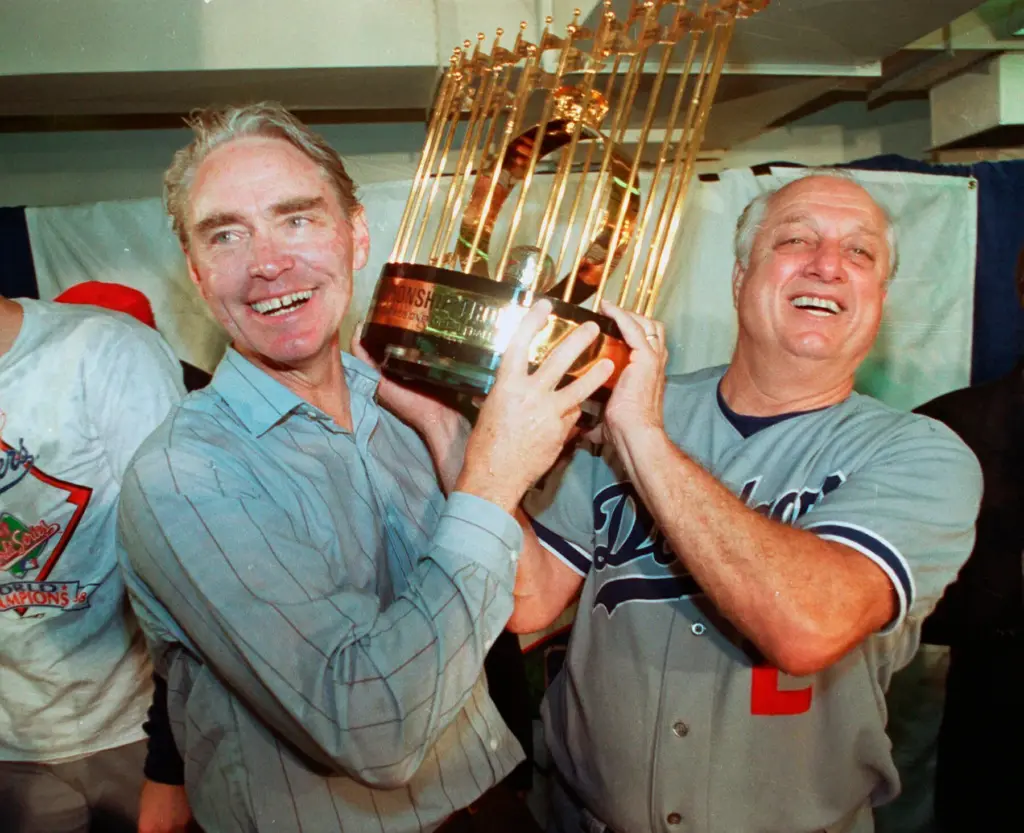 Los Angeles Dodgers manager Tommy Lasorda, right, and Fred Claire,...