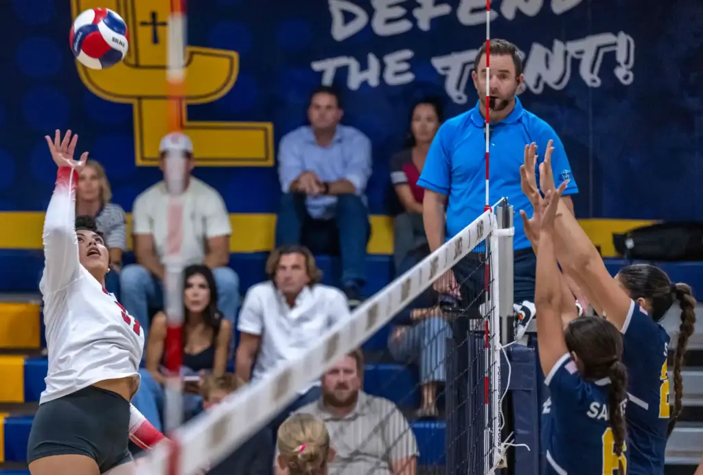 Redondo Union middle blocker Braunwyn Brown (37) hits the ball...