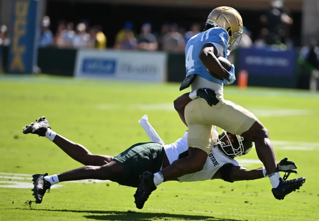 UCLA wide receiver Semaj Morgan (4) catches a pass for...