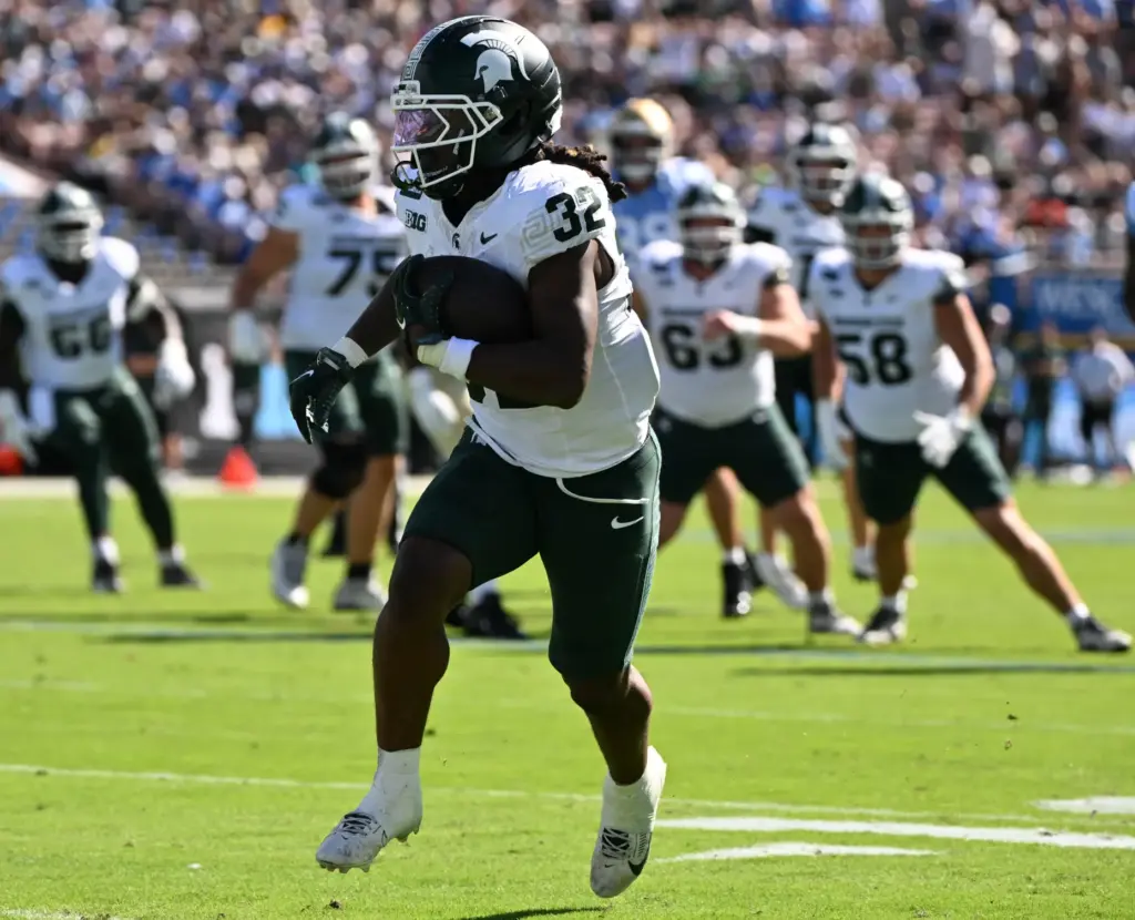 Michigan State running back Kenneth Williams (32) scores on a...
