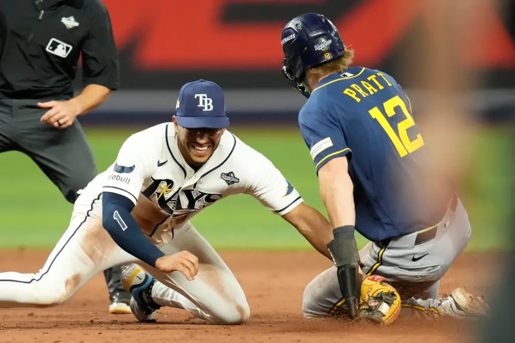 The Milwaukee Brewers’ Cooper Pratt is caught trying to steal...