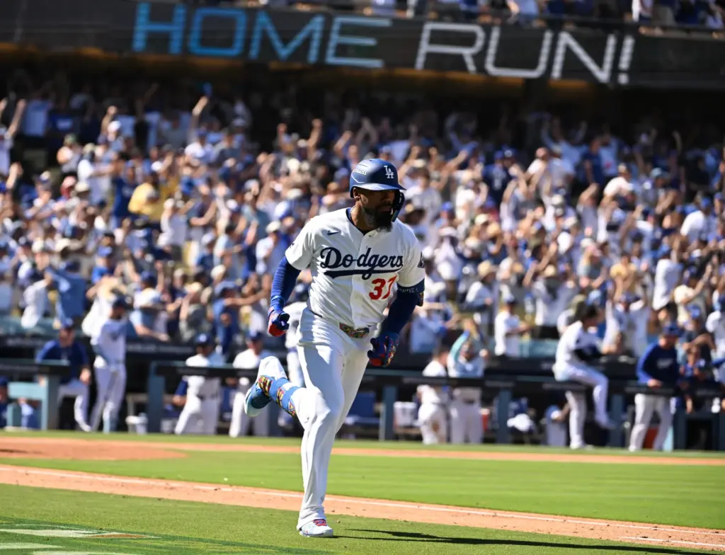 The Dodgers’ Teoscar HernÃ¡ndez runs the bases after hitting a...