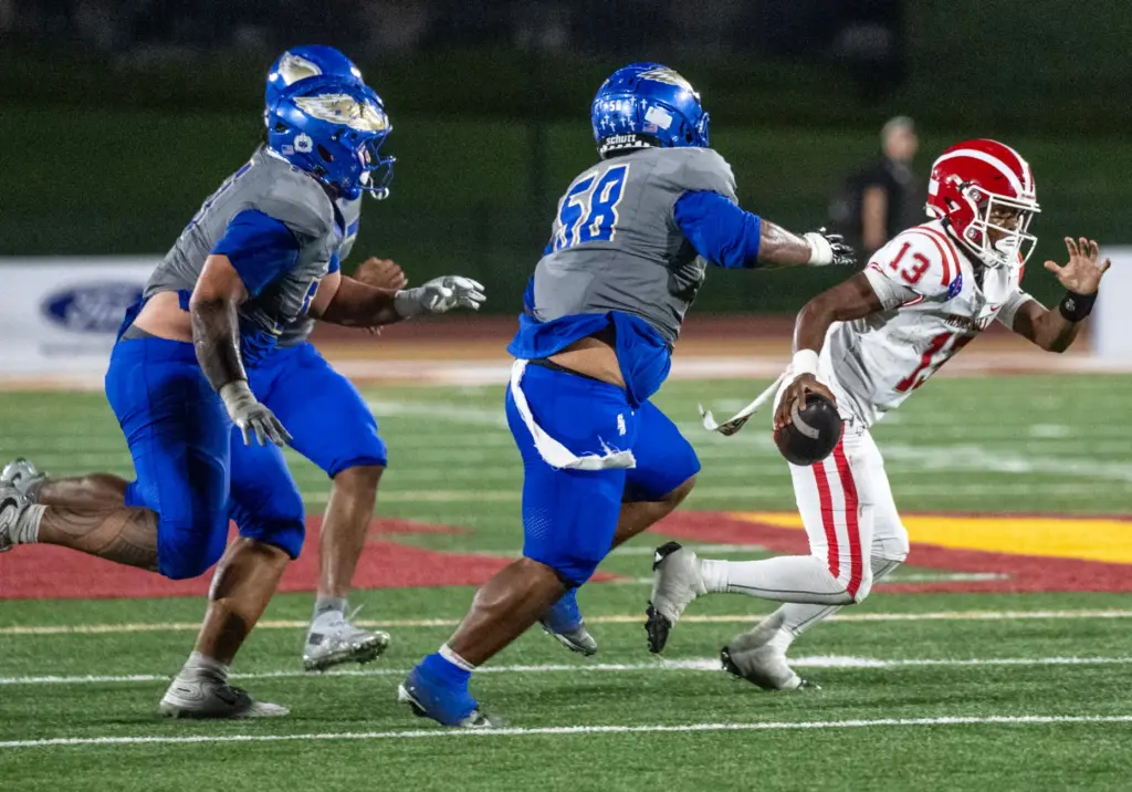 Mater Dei quarterback Paytyn Guess (13) carries the ball on...
