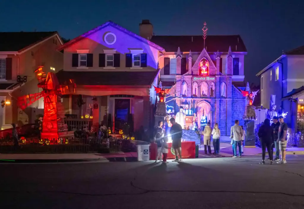 Visitors check out elaborate Halloween decorations featuring classic Universal Pictures...