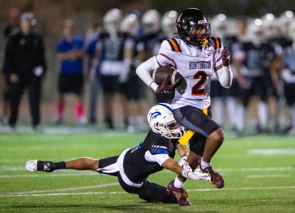 Huntington Beachâs Dylin Bruce (2) carries the ball during a...