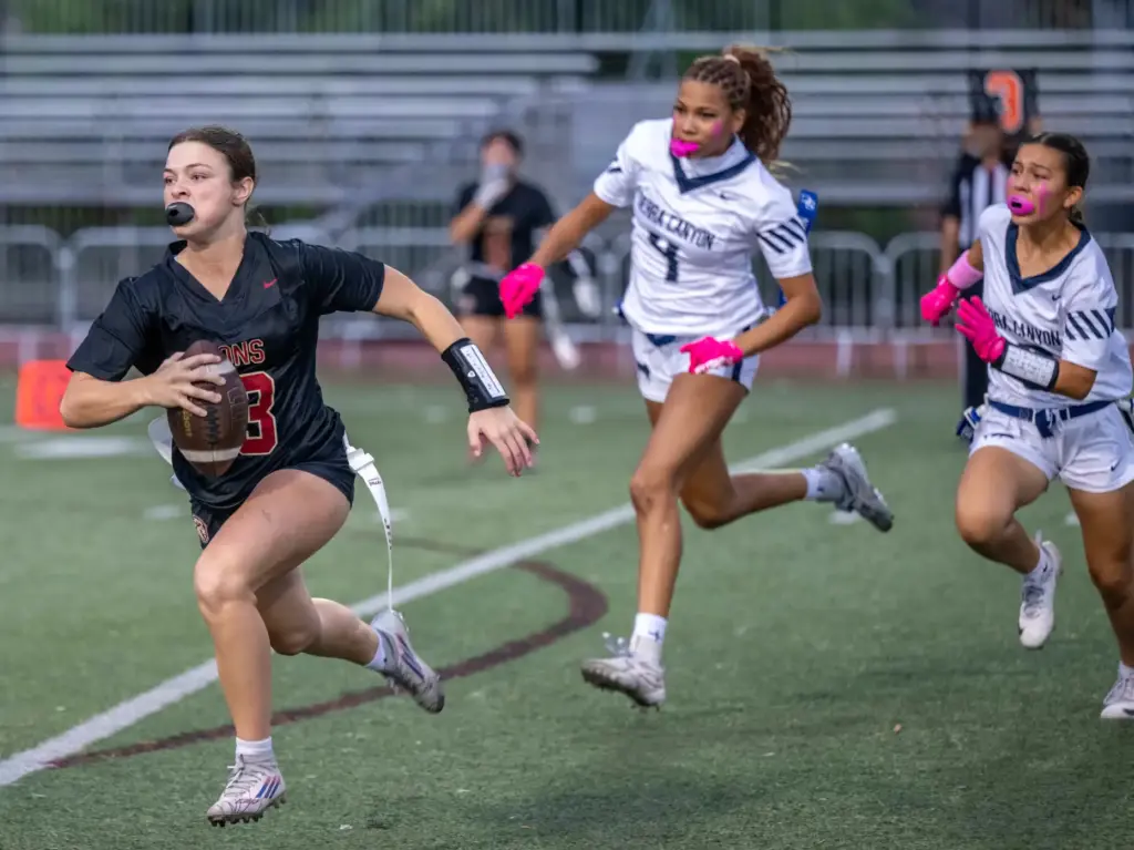 JSerra quarterback Kate Meier (13) carries the ball on a...