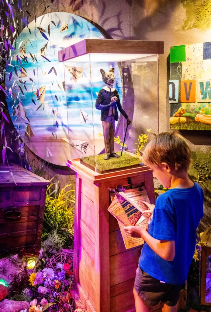 Ezra Davis, 9, reads the story of Oscar, a cat...