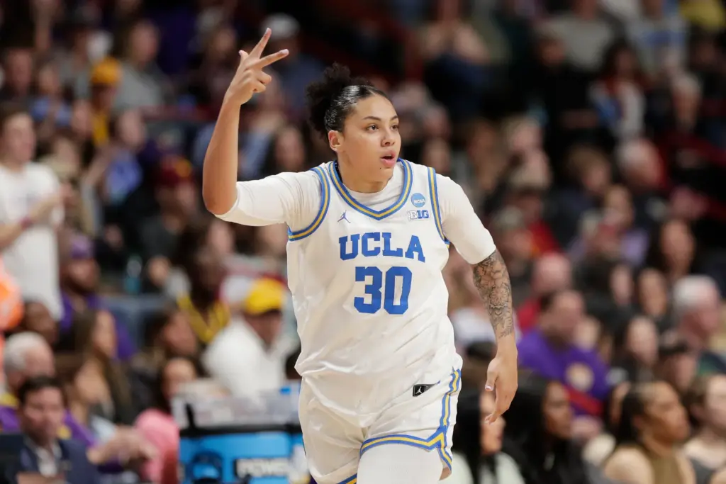 UCLA forward Timea Gardiner (30) celebrates after her 3-point basket...