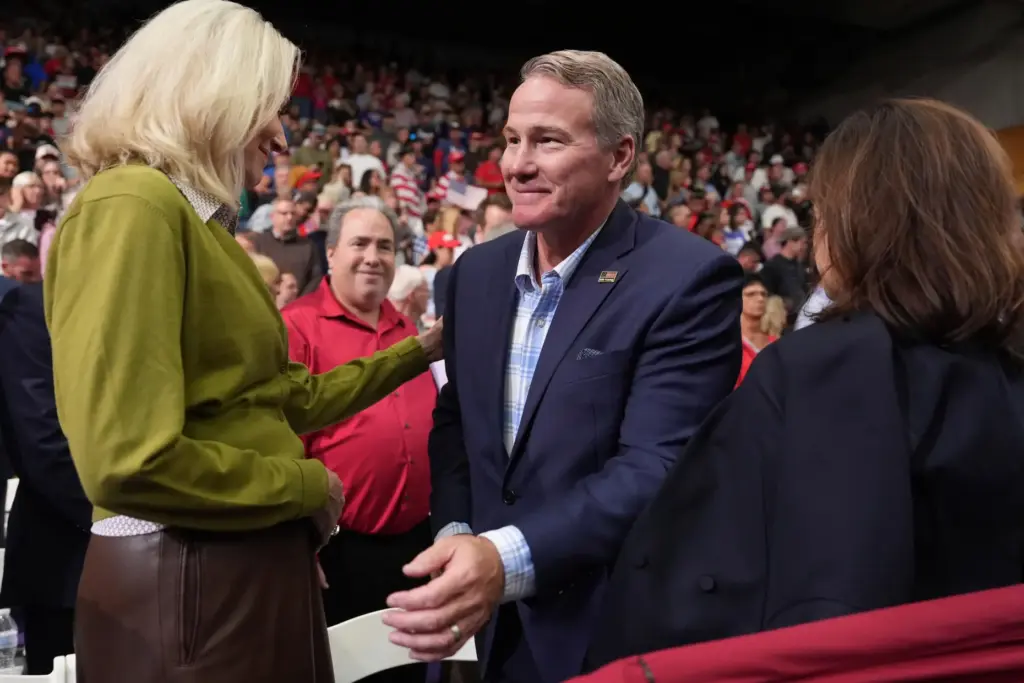 Sen. Jon Husted, R-Ohio, center, greets attendees before President Donald...
