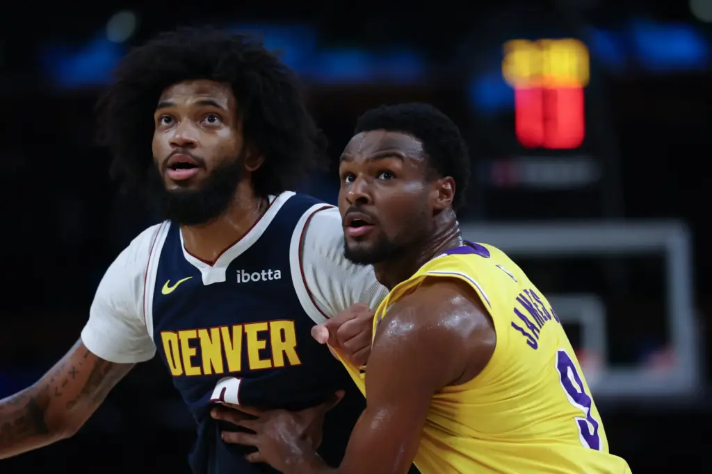 Denver Nuggets forward Marvin Bagley III, left, and Lakers guard...