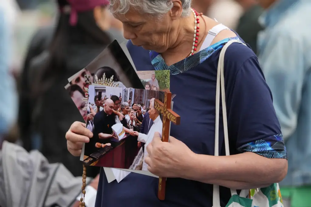 Faithful gather in St. Peter’s Square at the Vatican for...