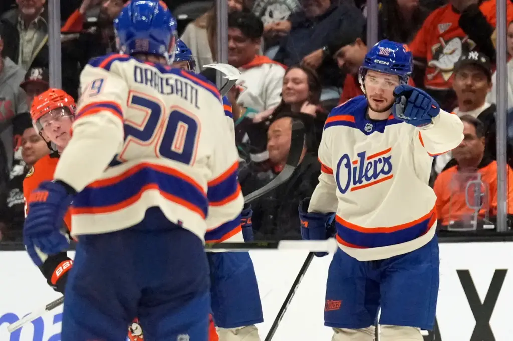 Edmonton Oilers right wing Vasily Podkolzin, right, celebrates his goal...
