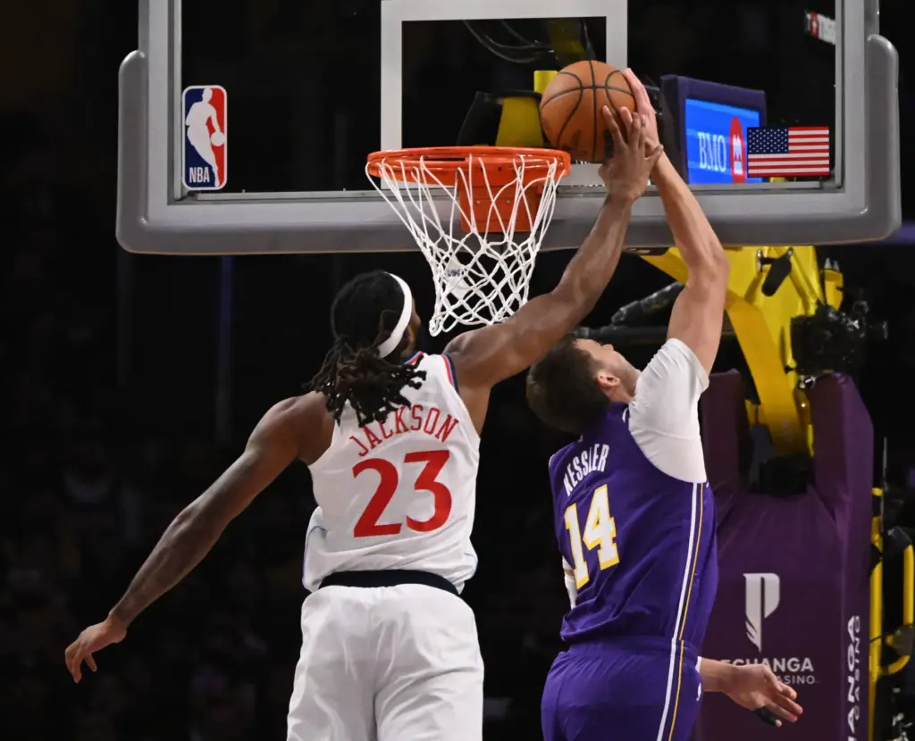 Clippers forward/center Isaiah Jackson, left, blocks a shot by Lakers...