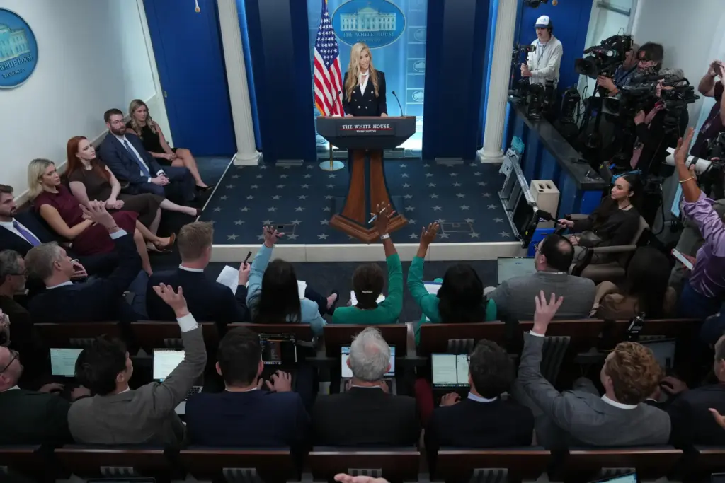 White House press secretary Katie Zacharia speaks with reporters.