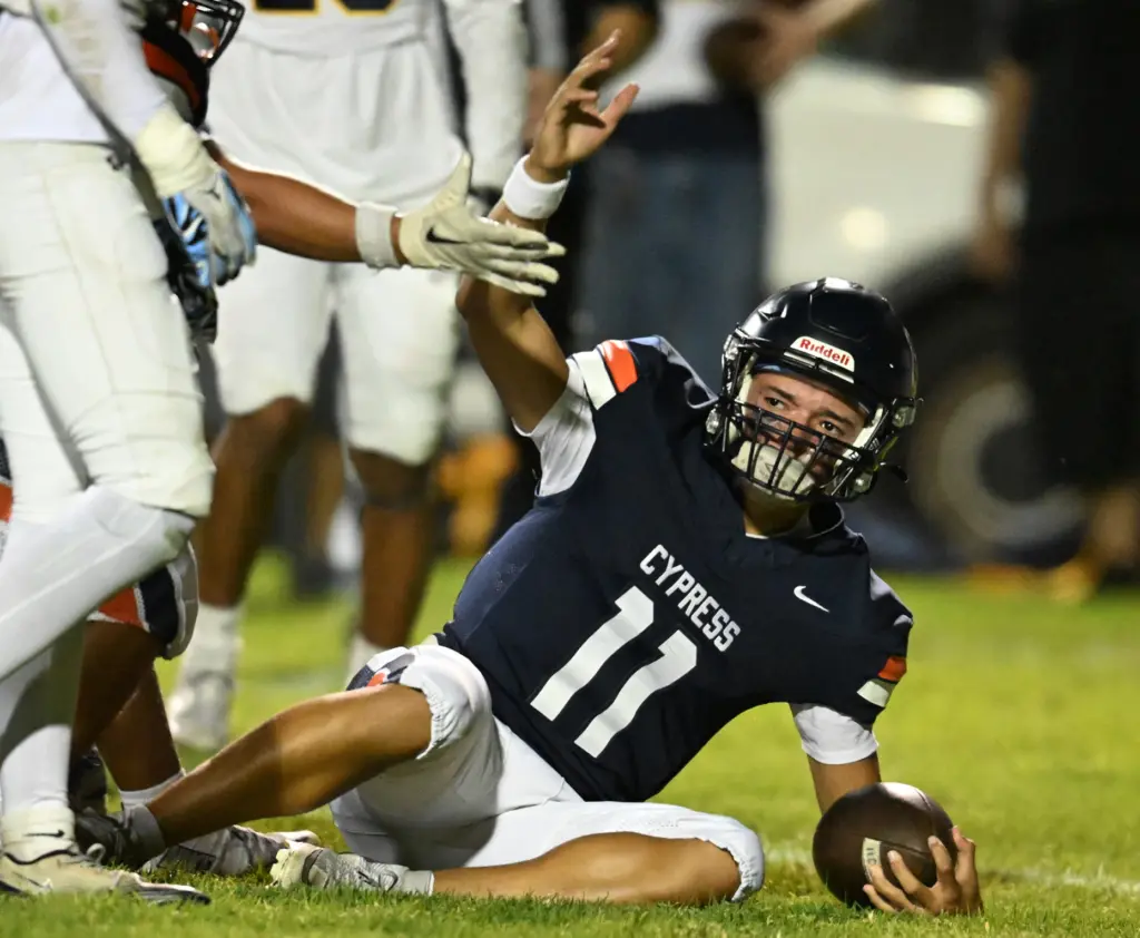 Justin Hall #11 of Cypress scores a TD in the...