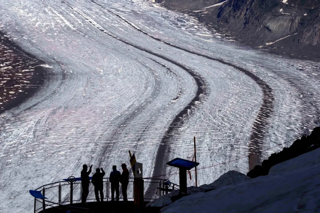 FILE — People enjoy the view at the Aletsch Glacier...