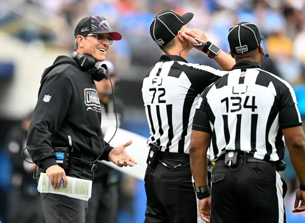 Chargers head coach Jim Harbaugh reacts to losing a challenge...