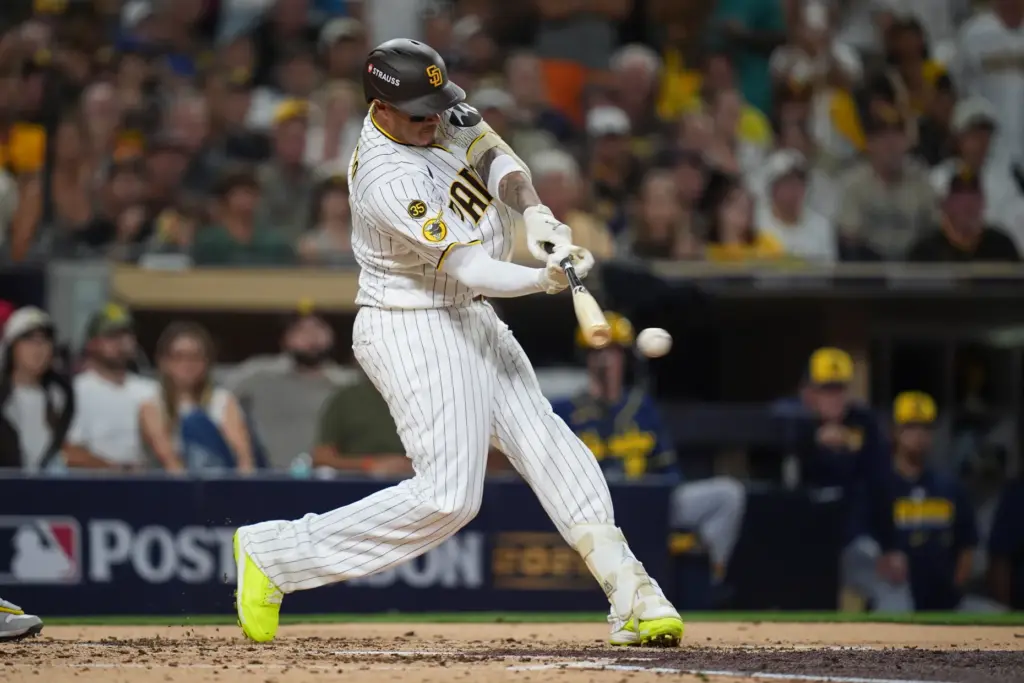 The San Diego Padres’ Manny Machado hits an RBI single...