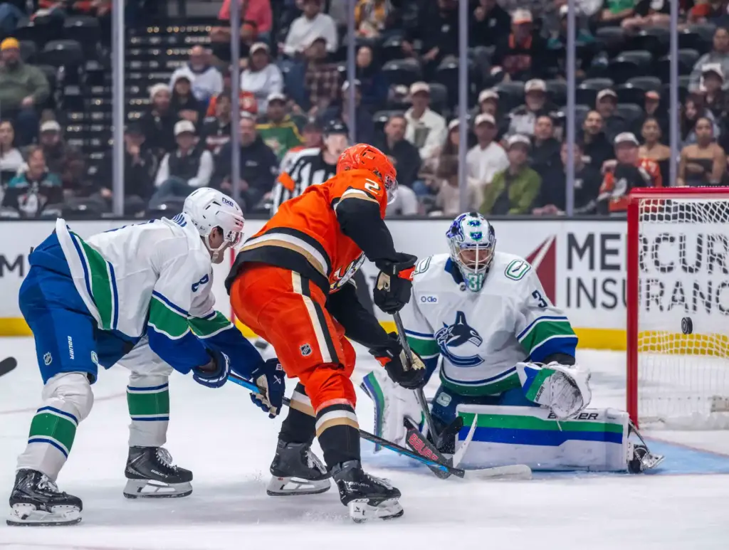 The Ducksâ Jackson LaCombe (2) takes a shot against Vancouver...