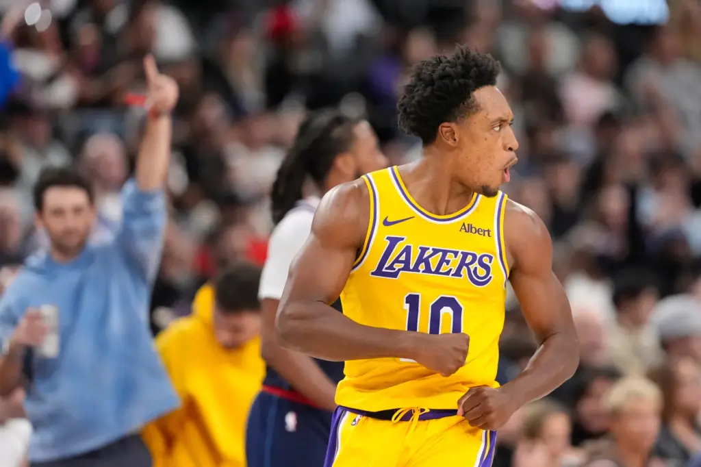Lakers guard Collin Sexton reacts after scoring during the second...