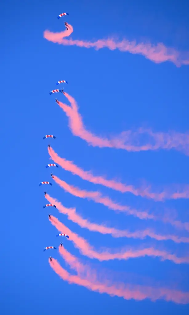 The Royal Air Force Falcons Parachute Team perform during the...