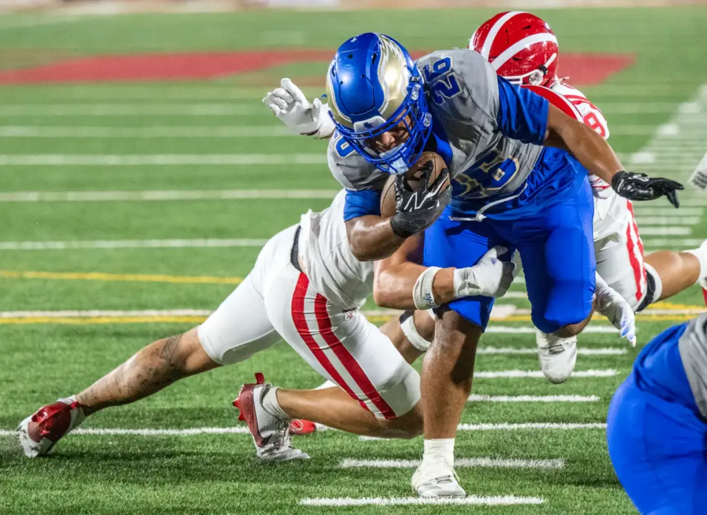 Santa Margarita running back Adrian Petero (26) carries the ball...