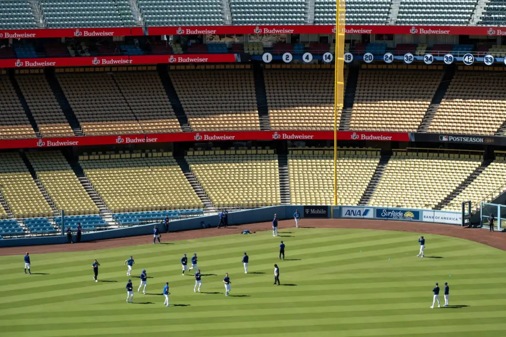 Dodgers players stretch before Game 4 of the National League...