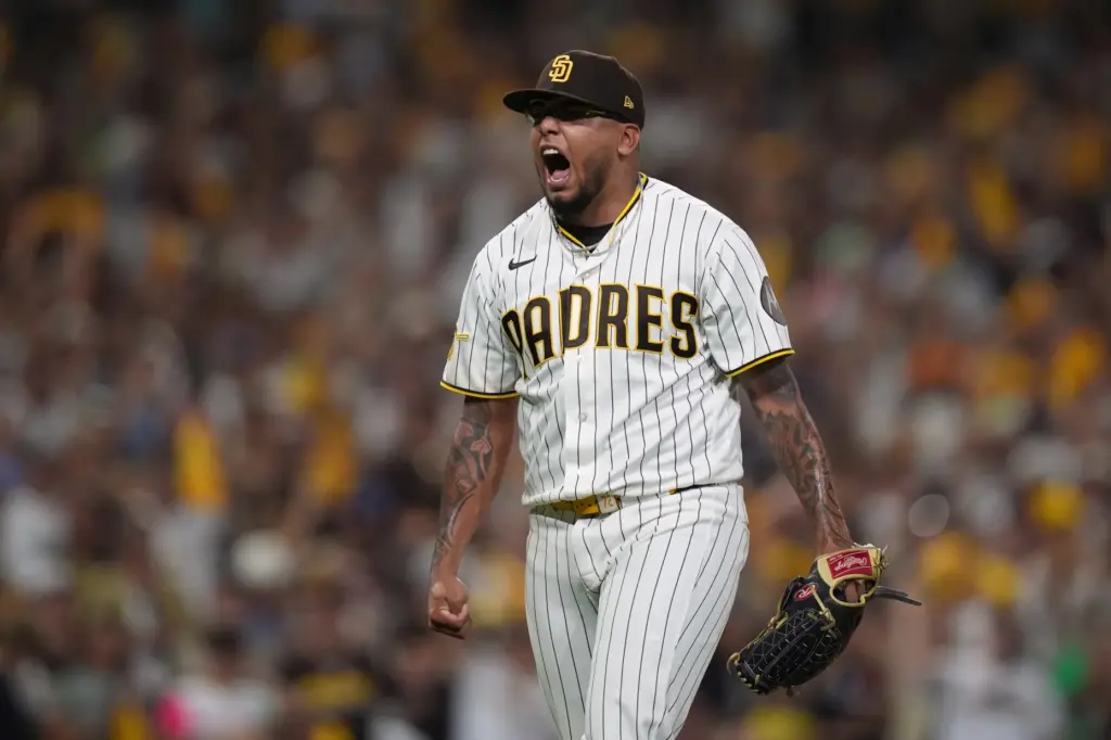 San Diego Padres relief pitcher Bradgley Rodriguez celebrates after striking...