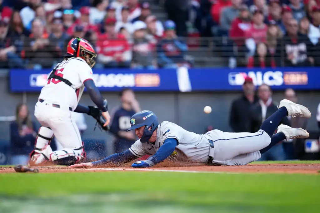 Tampa Bay Rays’ Ben Williamson scores past Cleveland Guardians catcher...