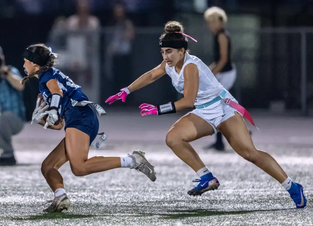 Newport Harbor defensive back Emma Yokoi (35) runs with the...