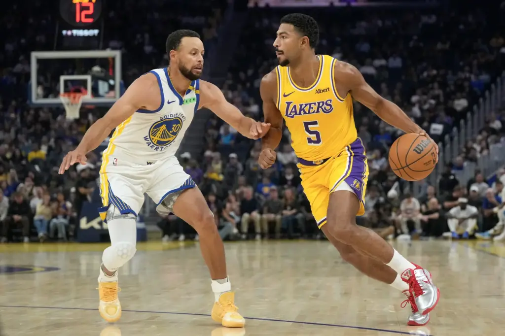 Lakers guard Quentin Grimes drives to the basket as Golden...