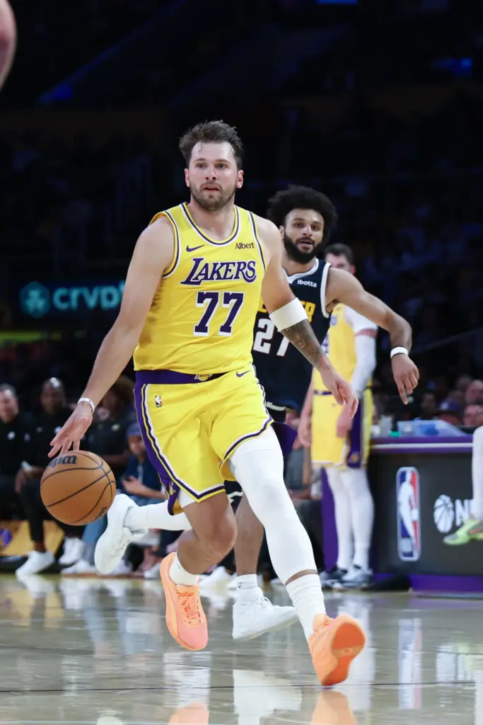 Lakers guard Luka Doncic brings the ball up the court...