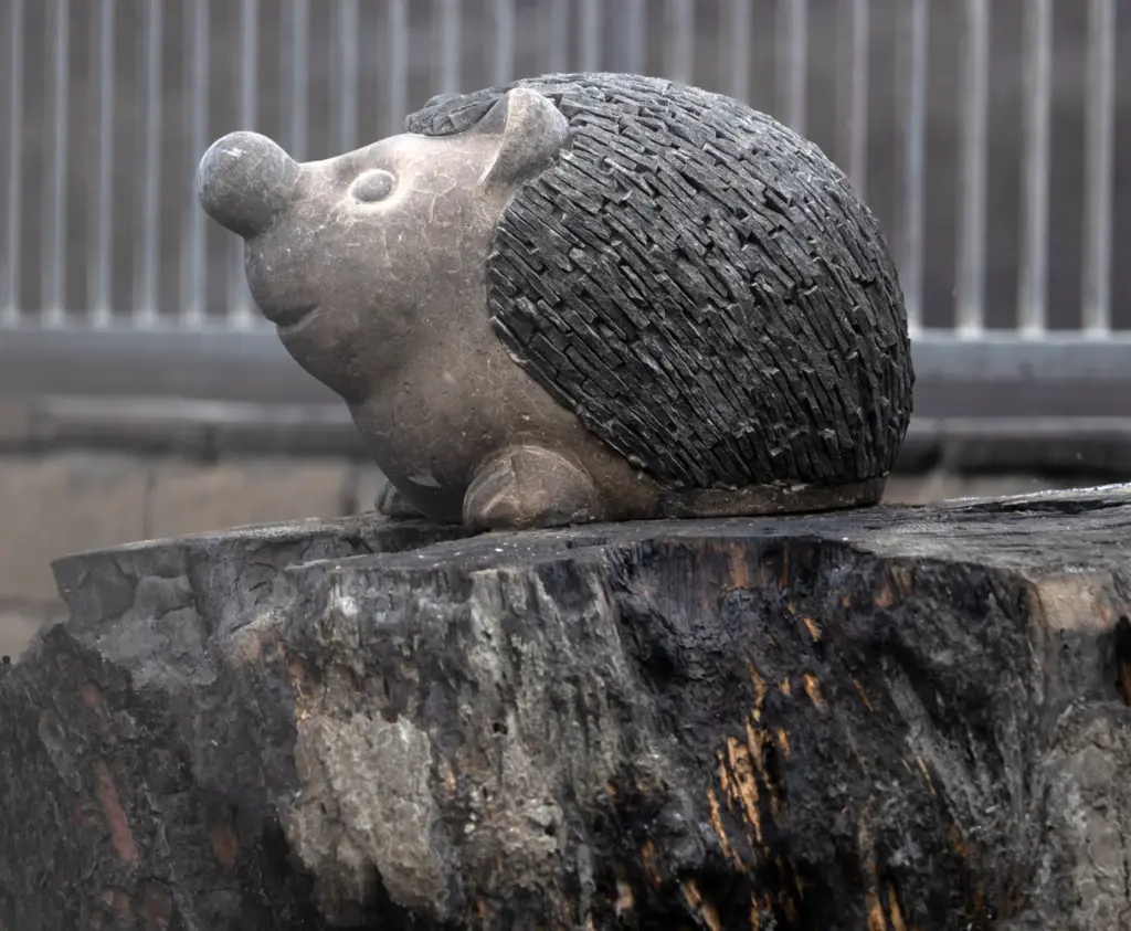 A garden decoration sits in a burned-out backyard in San...