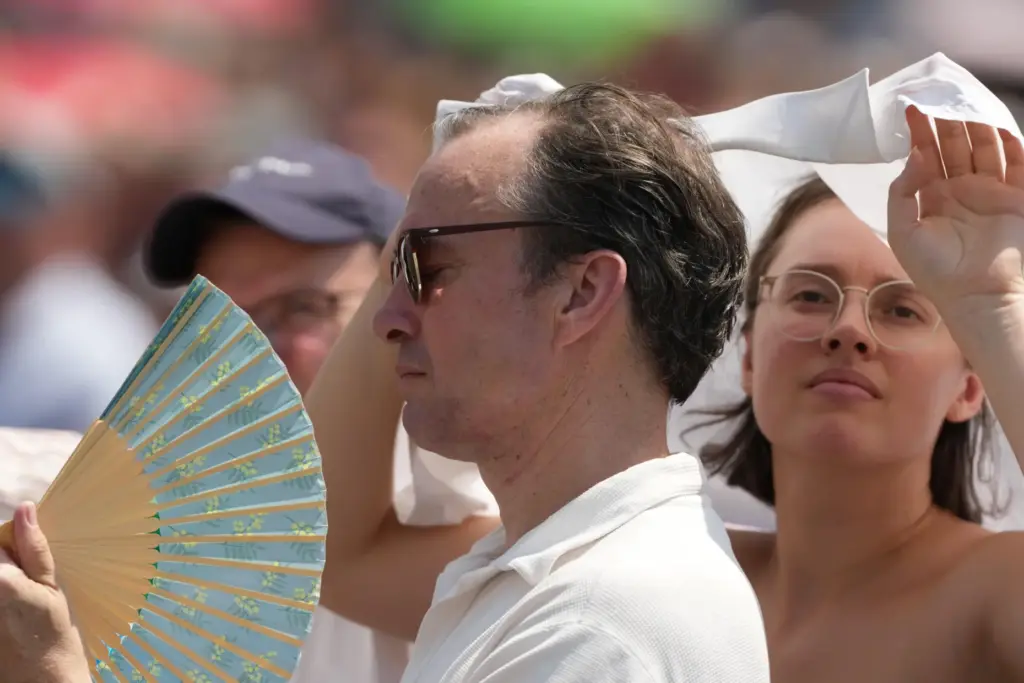 FILE – Faithful wait for the start of Pope Leo...