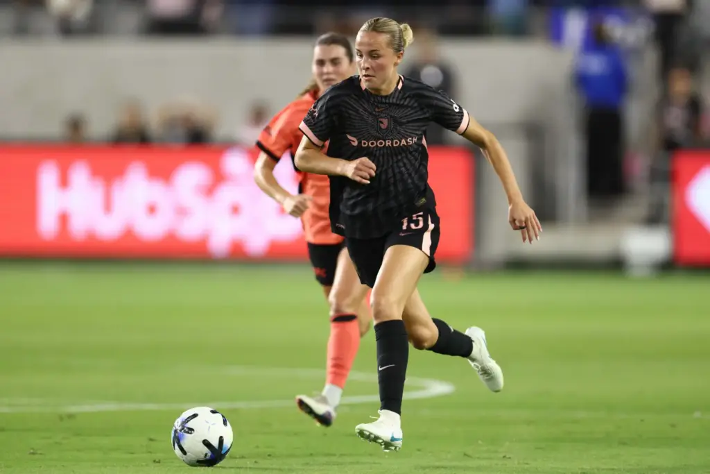 Angel City FC midfielder Evelyn Shores moves the ball against...