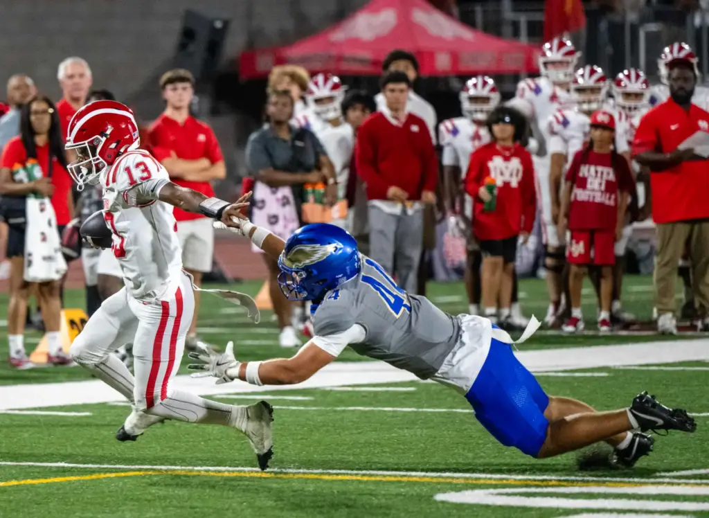 Mater Dei quarterback Paytyn Guess (13) carries the ball on...