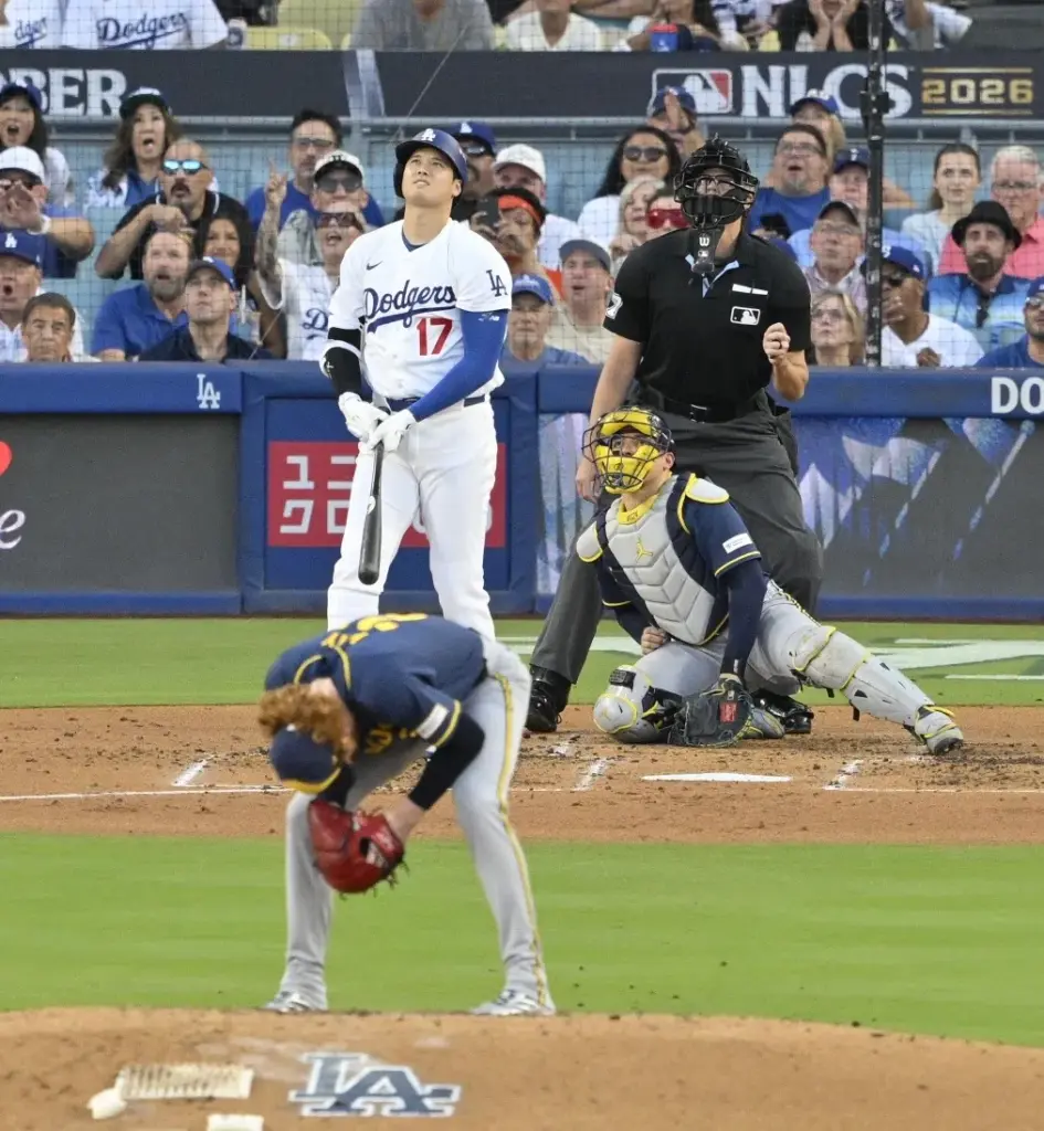 Dodgers star Shohei Ohtani watches the flight of his three-run...