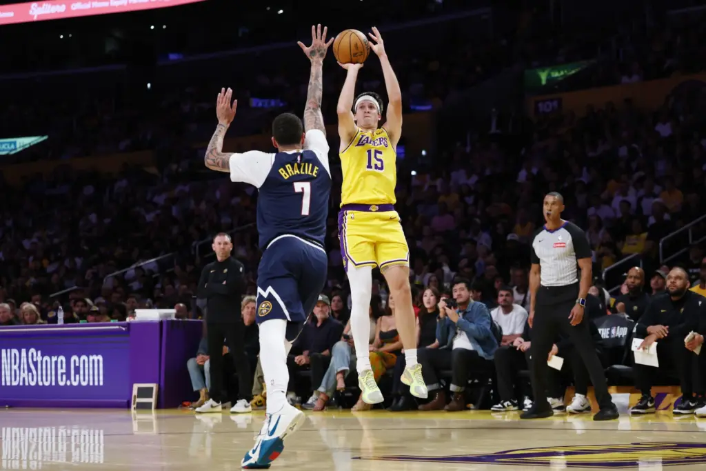 Lakers guard Austin Reaves takes a shot as Denver Nuggets...
