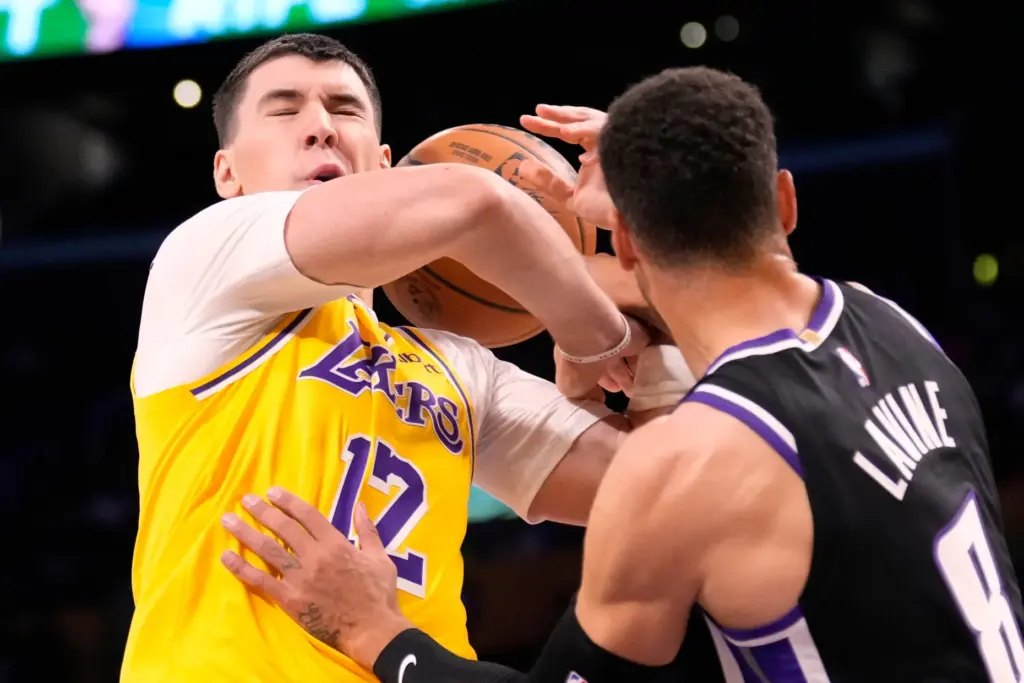 Sacramento Kings guard Zach LaVine, right, knocks the ball away...