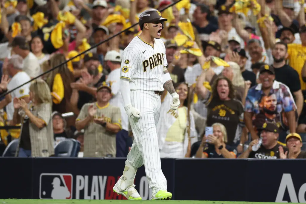 The San Diego Padres’ Manny Machado celebrates after reaching first...