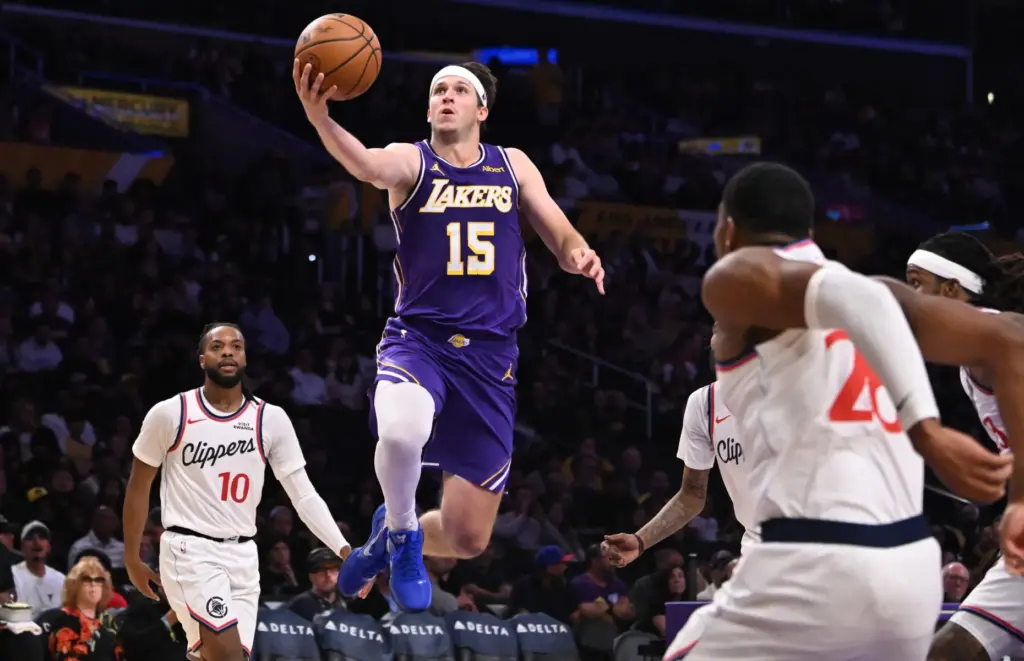 Lakers guard Austin Reaves drives to the basket during the...