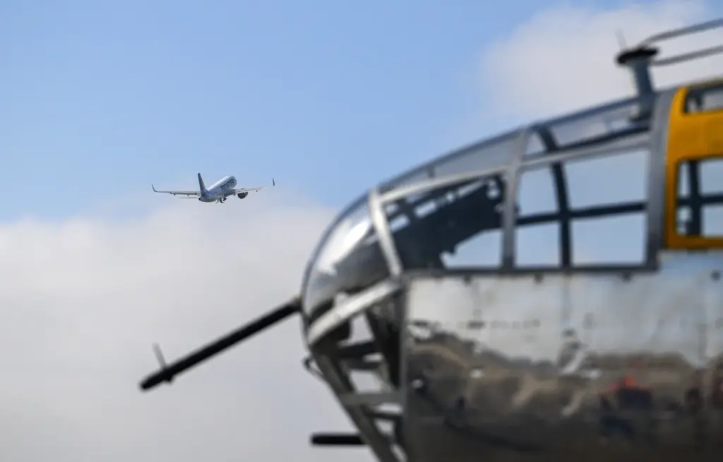 A Frontier airliner takes off from John Wayne Airport as...