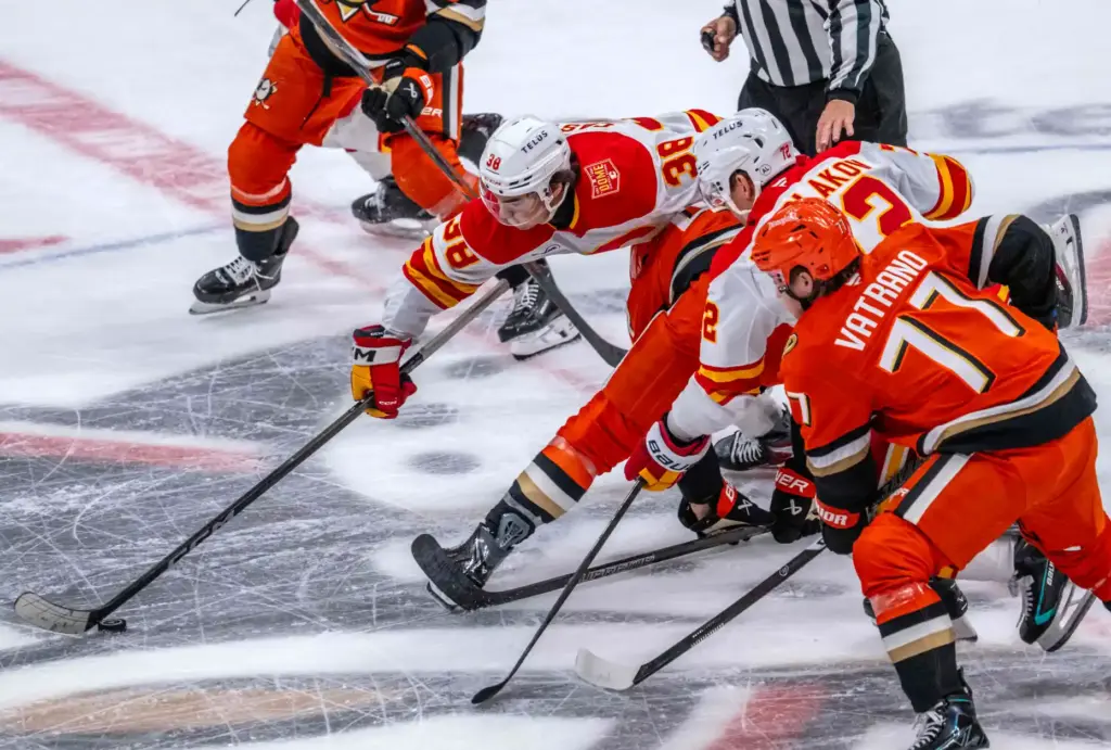 The Ducks’ Frank Vatrano (77) and the Calgary Flames’ Maxim...