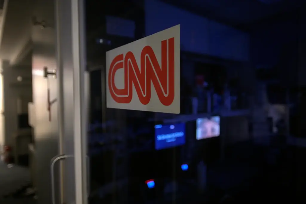 A logo on a booth for CNN at the White House