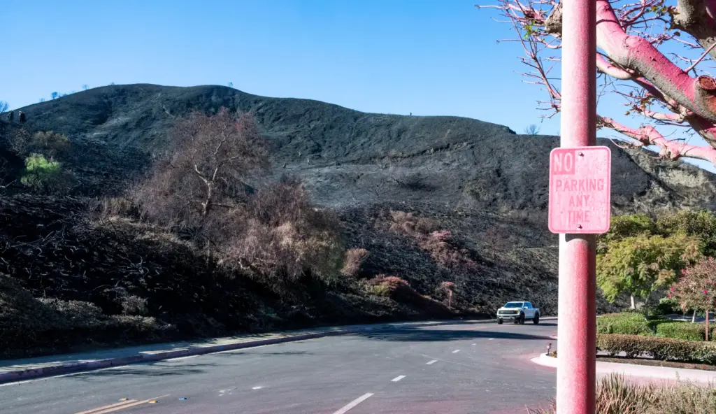 Fire retardant is evident near houses on Via Cerro Rebal...